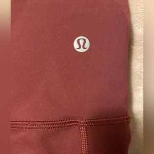 LULU LEGGINGS in like-new condition with Lulu bag from store size 12 maroon